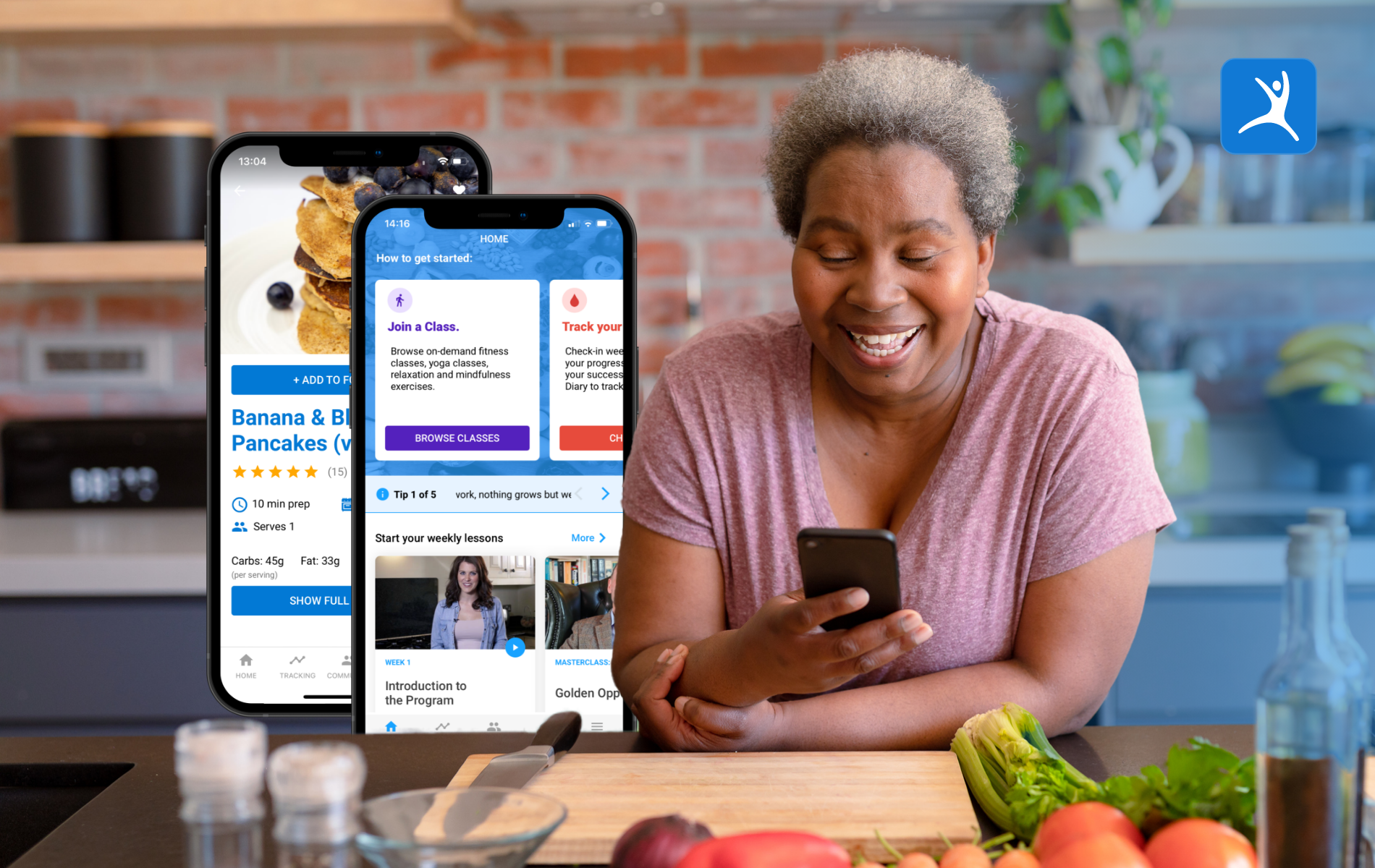 Person using phone app in kitchen surrounded by healthy vegetables.