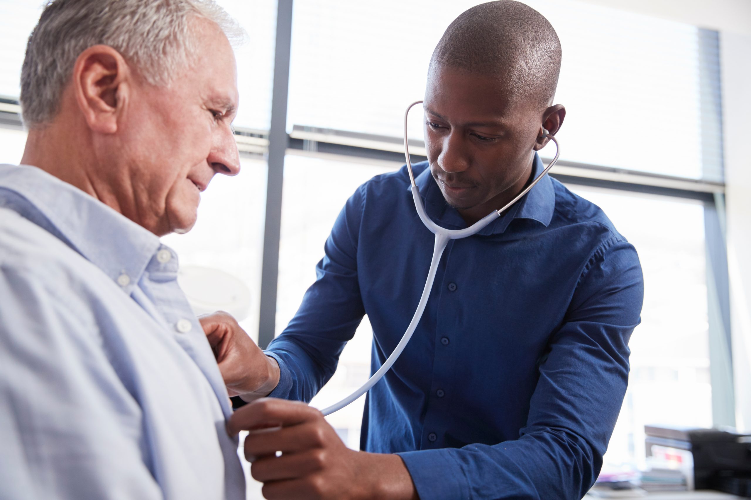 Doctor checking patient with stethoscope