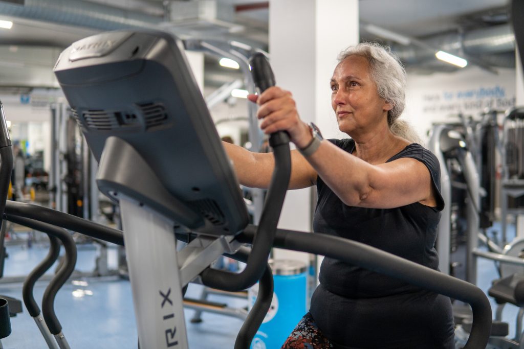 Woman using an exercise machine